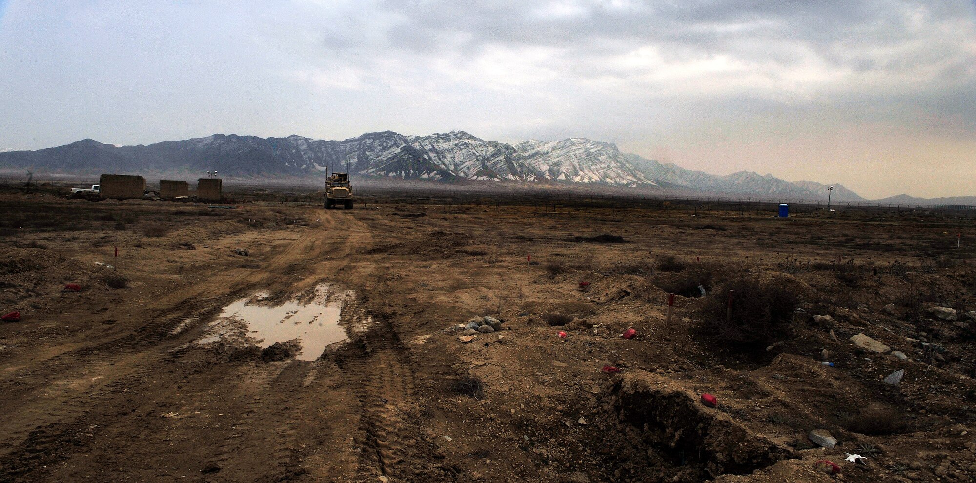 Airmen from the 966th Air Expeditionary Squadron Explosive Ordnance Disposal flight move their truck far enough away before setting off a controlled detonation at Bagram Airfield, Afghanistan, March 16, 2012. The EOD flight with the 966th AES is tasked to mitigate, render safe, or destroy any conventional or unconventional explosive threat as well as chemical, nuclear or biological hazards inside and outside the wire. Their operations can be performed 24-hours a day, seven days a week. Some of their responsibilities as EOD technicians include mitigating improvised explosive devices, post blast analysis and route clearing packages. (U.S. Air Force photo/Staff Sgt. Sara Csurilla)