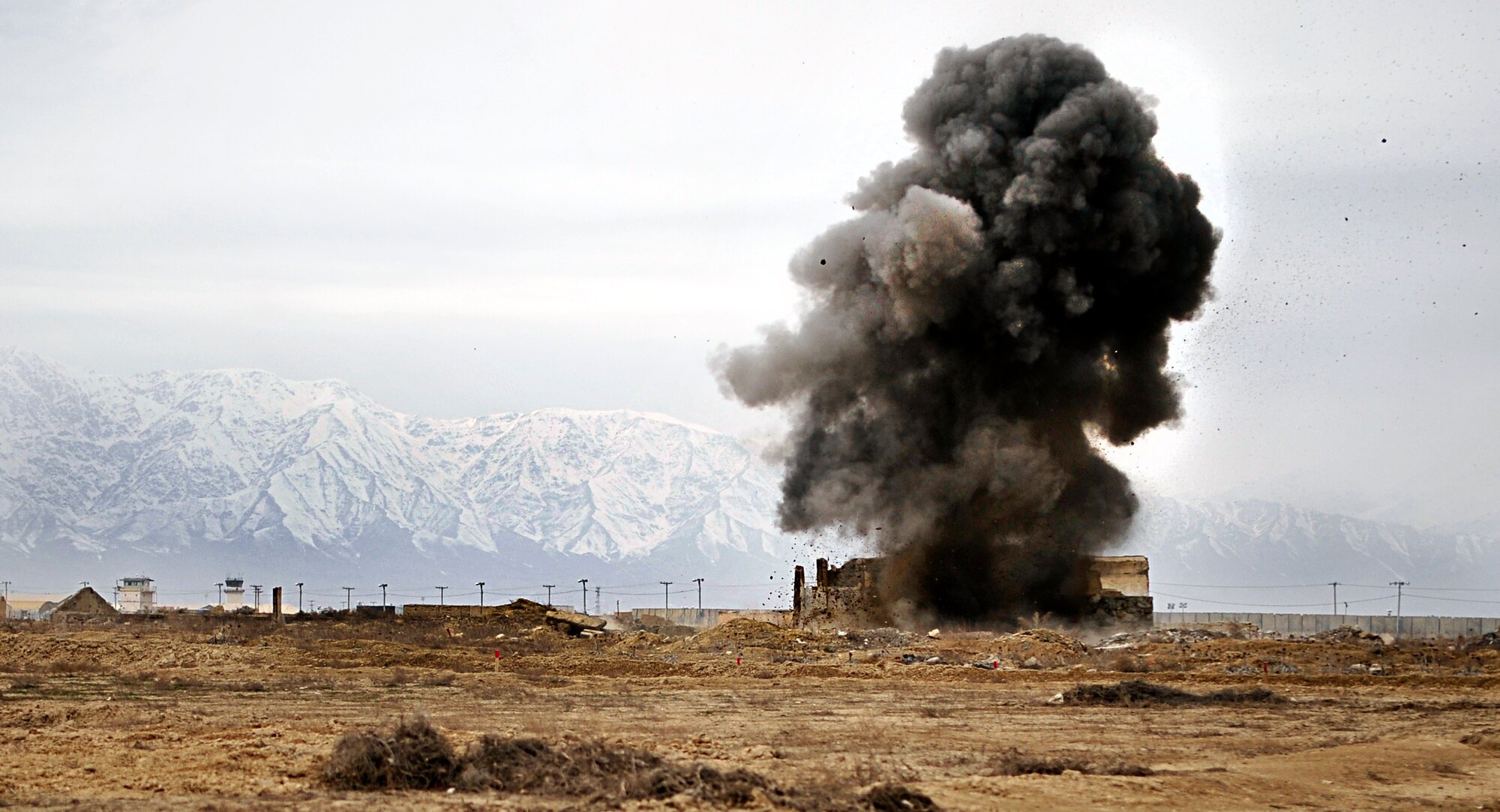 Airmen from the 966th Air Expeditionary Squadron Explosive Ordnance Disposal flight set off a controlled detonation at Bagram Airfield, Afghanistan, March 16, 2012. The EOD flight with the 966th AES is tasked to mitigate, render safe, or destroy any conventional or unconventional explosive threat as well as chemical, nuclear or biological hazards inside and outside the wire. Their operations can be performed 24-hours a day, seven days a week. Some of their responsibilities as EOD technicians include mitigating improvised explosive devices, post blast analysis and route clearing packages. (U.S. Air Force photo/Staff Sgt. Sara Csurilla)