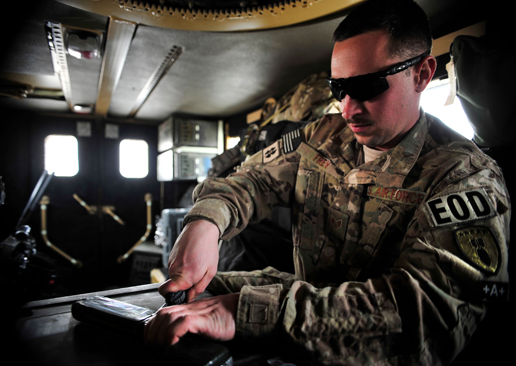 U.S. Air Force Staff Sgt. Dustin Frey, an Explosive Ordinance Disposal Airman deployed to the 966th Air Expeditionary Squadron at Bagram Airfield, Afghanistan, cuts blocks of C-4 before performing a controlled detonation March 15, 2012. Frey is deployed to Afghanistan from the Nebraska Air National Guard, 155th Air Refueling Wing, Lincoln, Neb. The EOD flight with the 966th AES is tasked to mitigate, render safe, or destroy any conventional or unconventional explosive threat as well as chemical, nuclear or biological hazards inside and outside the wire. Their operations can be performed 24-hours a day, seven days a week. Some of their responsibilities as EOD technicians include mitigating improvised explosive devices, post blast analysis and route clearing packages. (U.S. Air Force photo/Staff Sgt. Sara Csurilla)