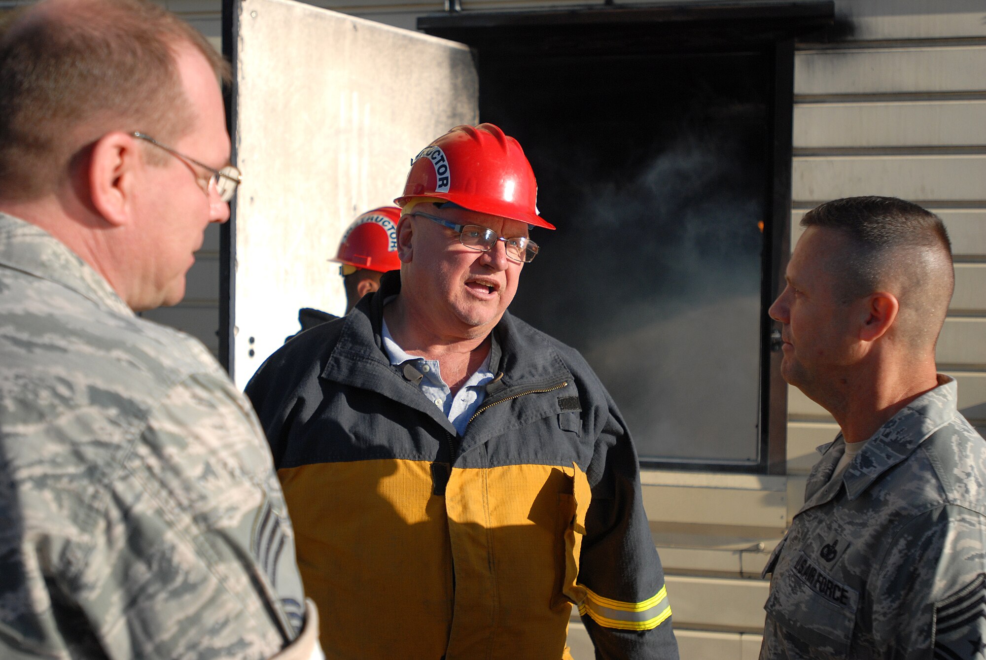 GOODFELLOW AIR FORCE BASE, Texas -- Joe Zapala, Louis F. Garland Department of Defense Fire Academy facility manager, and Chief. Master Sgt. Andrew Barth, 312th Training Squadron Superintendent, give a tour of the Fire Academy to Chief Master Sgt. Oscar Mackin, 2nd Air Force Command Chief, March 22. During his visit Chief Mackin stopped by a variety of squadrons to get a feel of the Team Goodfellow mission. (U.S. Air Force photo/ Airman 1st Class Michael Smith)