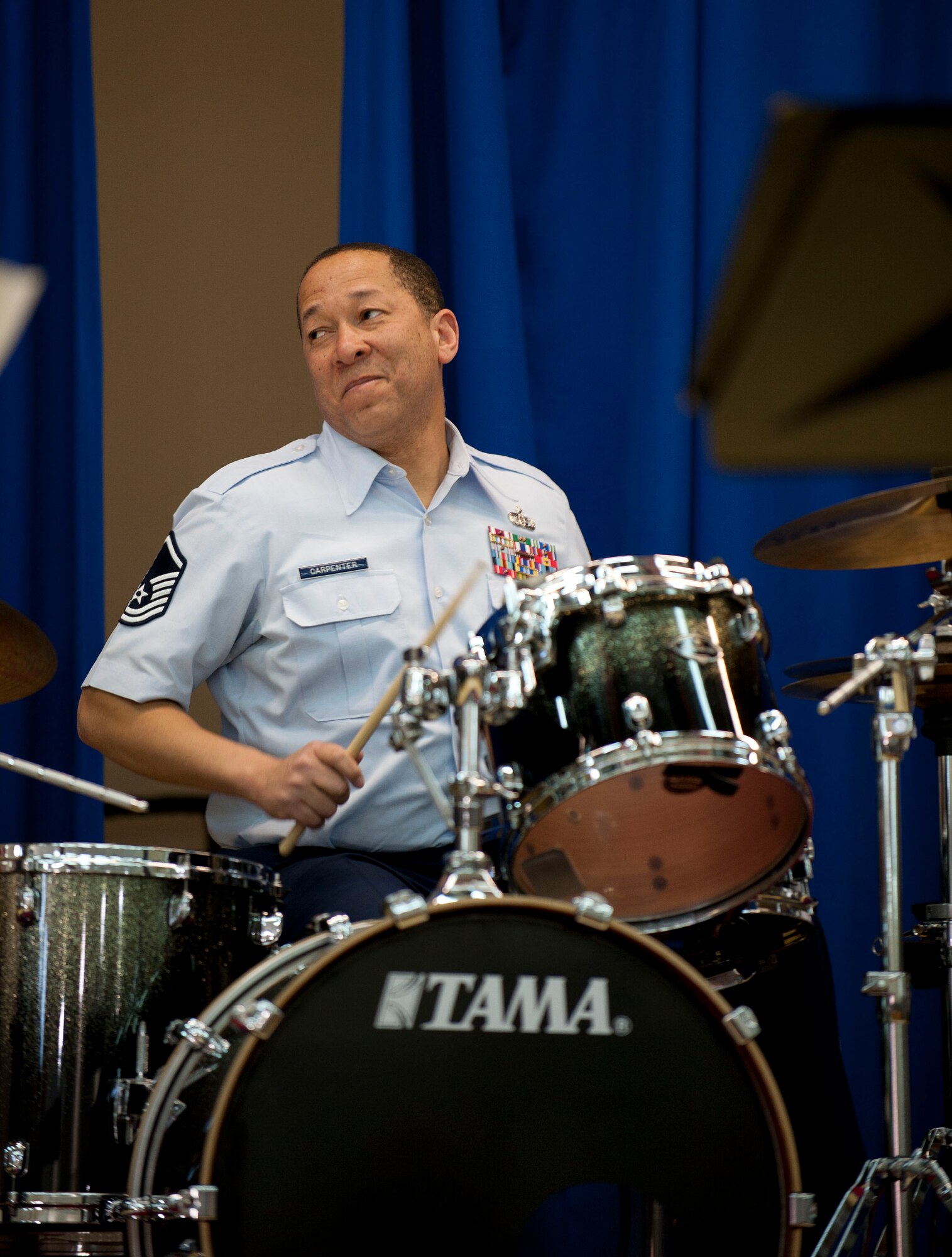 Master Sgt. Clarence Carpenter, drummer for U.S. Air Forces in Europe Band "Wings of Dixie," performs in the Incirlik Unit School multipurpose room March 22, 2012, at Incirlik Air Base, Turkey. Wings of Dixie performed several times for the school as part of the Music in Our Schools program and put on a show for members of Team Incirlik in the Club Complex ballroom March 23. (U.S. Air Force photo by Senior Airman Clayton Lenhardt/Released)