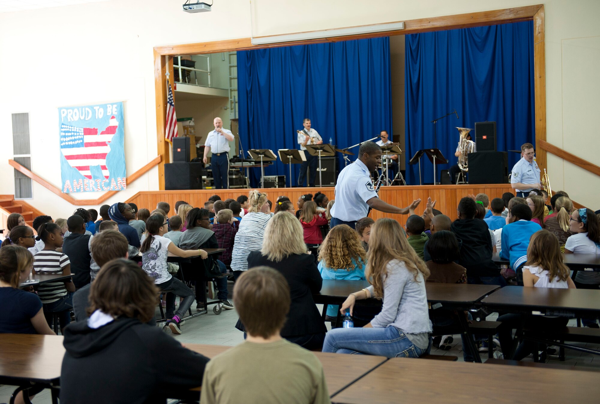 U.S. Air Forces in Europe Band "Wings of Dixie" performs in the Incirlik Unit School multipurpose room March 22, 2012, at Incirlik Air Base, Turkey. Wings of Dixie performed several times for the school as part of the Music in Our Schools program and put on a show for members of Team Incirlik in the Club Complex ballroom March 23. (U.S. Air Force photo by Senior Airman Clayton Lenhardt/Released)