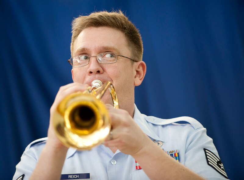 Tech. Sgt. Jeffrey Reich, trumpet player for U.S. Air Forces in Europe Band "Wings of Dixie," performs in the Incirlik Unit School multipurpose room March 22, 2012, at Incirlik Air Base, Turkey. Wings of Dixie performed several times for the school as part of the Music in Our Schools program and put on a show for members of Team Incirlik in the Club Complex ballroom March 23. (U.S. Air Force photo by Senior Airman Clayton Lenhardt/Released)