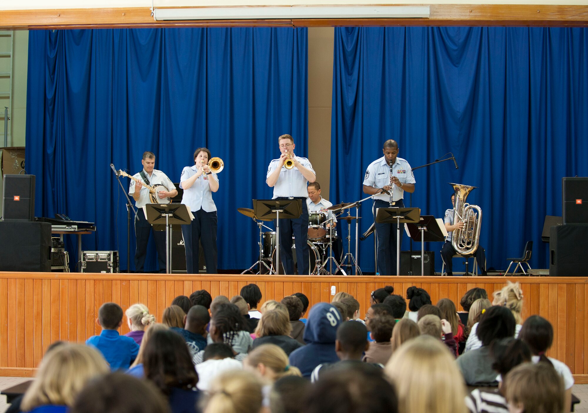 U.S. Air Forces in Europe Band "Wings of Dixie" performs in the Incirlik Unit School multipurpose room March 22, 2012, at Incirlik Air Base, Turkey. Wings of Dixie performed several times for the school as part of the Music in Our Schools program and put on a show for members of Team Incirlik in the Club Complex ballroom March 23. (U.S. Air Force photo by Senior Airman Clayton Lenhardt/Released)