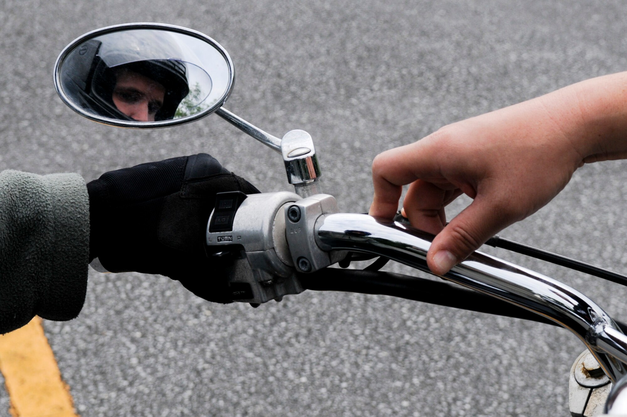 U.S. Air Force Staff Sgt. Craig Virginia, 18th Security Forces Squadron patrolman, receives instruction on turns and leans during a motorcycle safety course on Kadena Air Base, Japan, March 20, 2012. Pacific Air Forces requires all new riders to enroll in the motorcycle safety course to learn proper riding techniques, especially while overseas. (U. S. Air Force photo by Airman 1st Class Tara A. Williamson/Released)