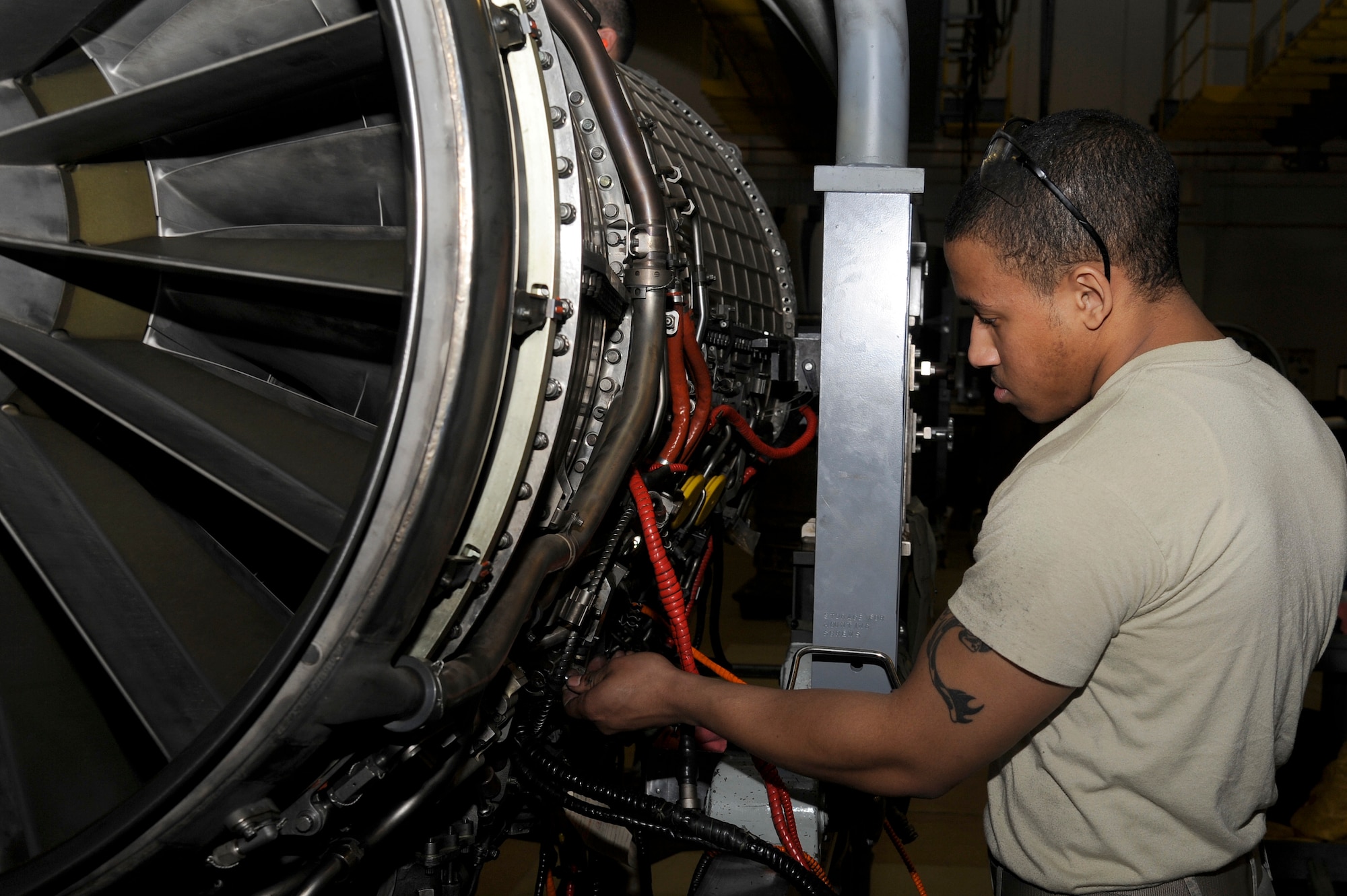 U.S. Air Force Airman 1st Class Michael Bond, 35th Maintenance Squadron aerospace propulsion journeyman, breaks down an F-16 Fighting Falcon F110-100 model engine at Misawa Air Base, Japan, March 27, 2012. The propulsion shop is the centralized intermediate repair facility for Misawa, Osan and Kunsan Air Bases. (U.S. Air Force photo by Tech. Sgt. Marie Brown/Released)
