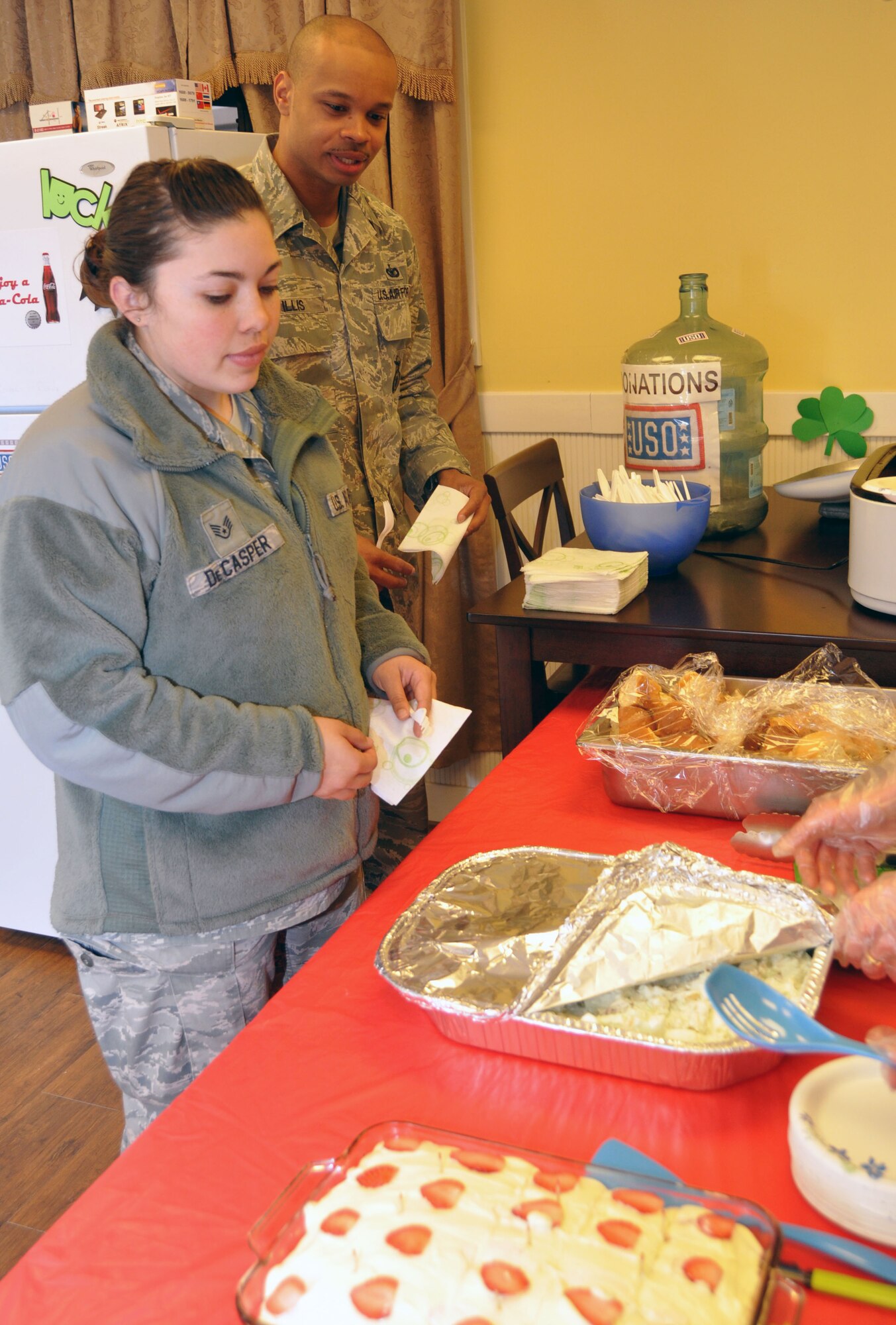Staff Sgt. Jessica De Casper, 51st Security Forces Squadron, participates in the bi-weekly Dine for a Dime program at the Osan USO March 14, 2012. Made up of volunteers around base, the USO program serves an average of 80 service members during each meal. (U.S. Air Force photo/Airman 1st Class Michael Battles)