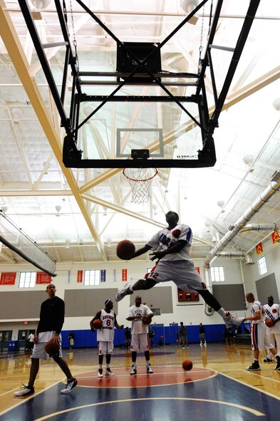 Airman 1st Class Marcus Middlebrooks from the 36th Logistics Readiness
Squadron jumps for the hoop during a warm-up session March 17 at Andersen
AFB.  (U.S. Air Force photo/Senior Airman Carlin Leslie) 
