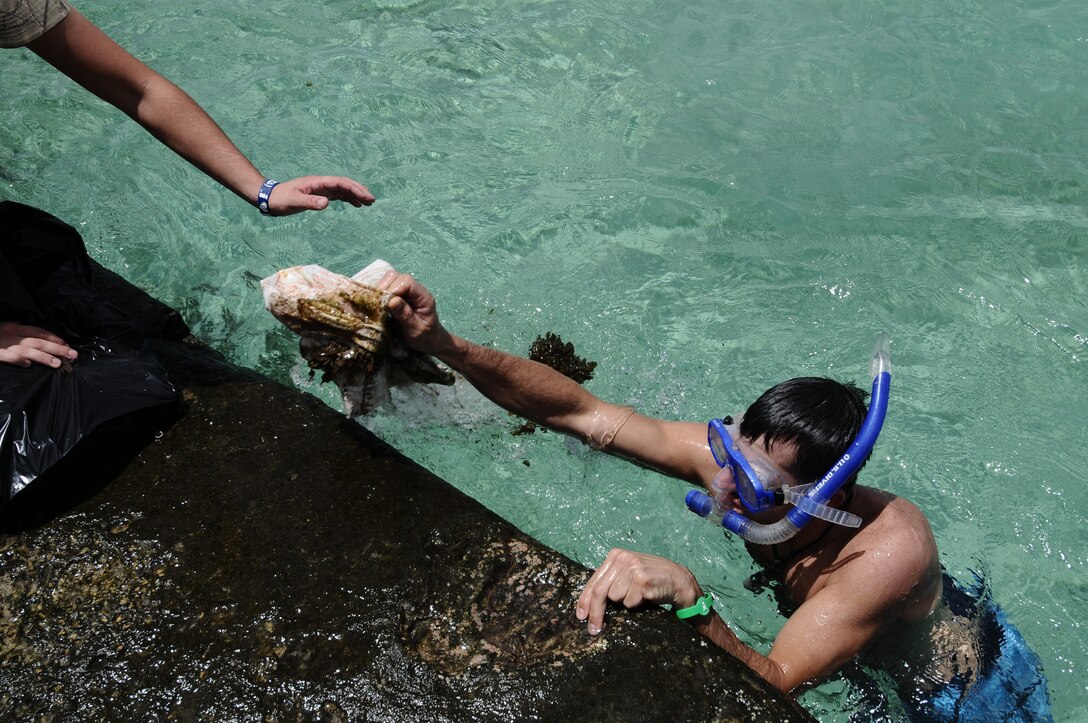 Airmen from the 36th Security Forces Squadron spend time cleaning Tangisen
Beach in the Dededo, Guam, March 22.  Assisting in such events allow Team
Andersen Airmen to get out and enjoy Guam while participating in the local
community.  (U.S. Air Force photo/Airman 1st Class Mariah Haddenham)

