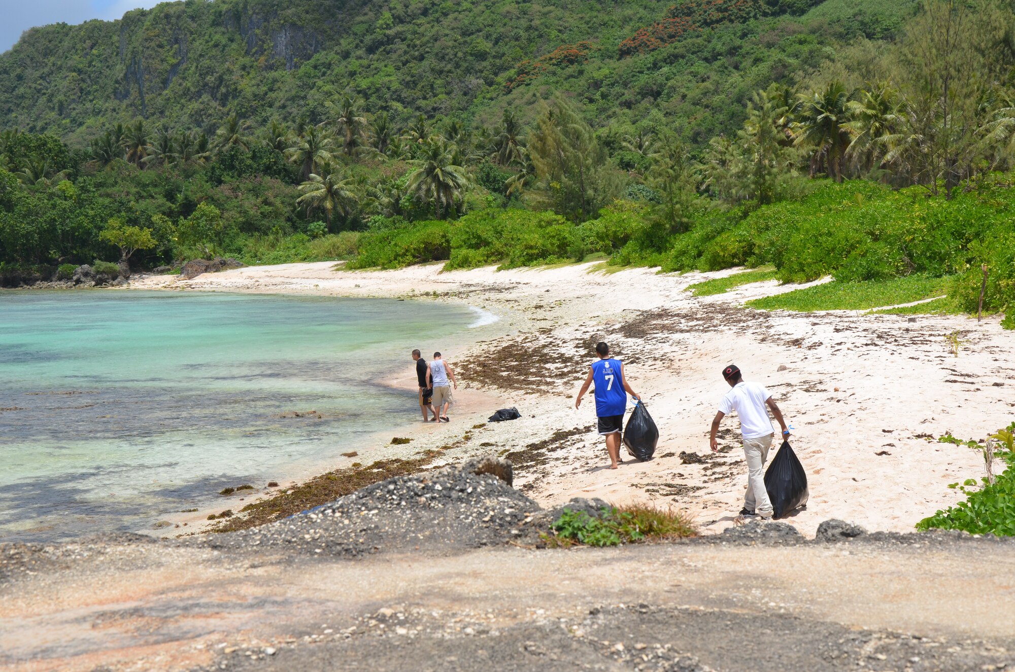 Airmen from the 36th Security Forces Squadron spend time cleaning Tangisen
Beach in the Dededo, Guam, March 22.  Assisting in such events allow Team
Andersen Airmen to get out and enjoy Guam while participating in the local
community.  (U.S. Air Force photo/Senior Airman Veronica McMahon)
