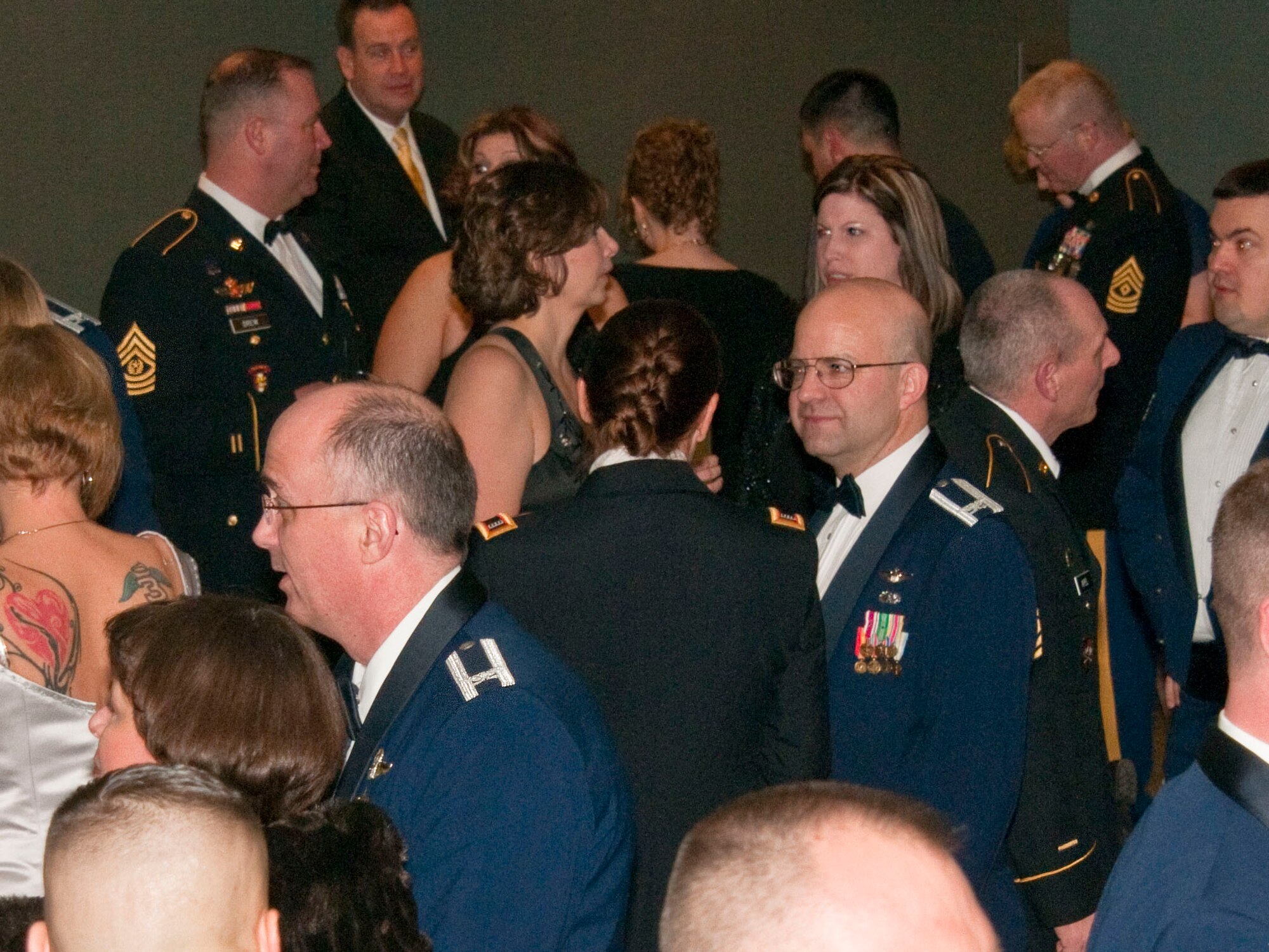 ANCHORAGE, Alaska -- Army and Air Gaurdsmen mingle March 23 at the Joint National Guard Ball in downtown Anchorage. Alaska Guardsmen celebrated the National Guard's 375th birthday at the Dena'ina Civic and Convention Center. National Guard Photo by Staff Sgt. N. Alicia Goldberger.