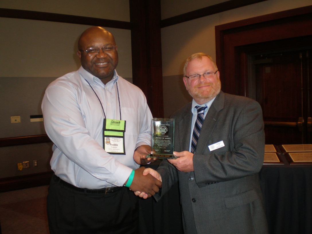 SAN DIEGO -- U.S. Army Corps of Engineers Old Hickory Lake natural resource manager Frederick Bell (left) receives the Award of Merit for the National Water Safety Congress Region 3 Vice President Ernest Lentz March 5, 2012 during the National Water Safety Congress during the International Boating and Water Safety Summit.