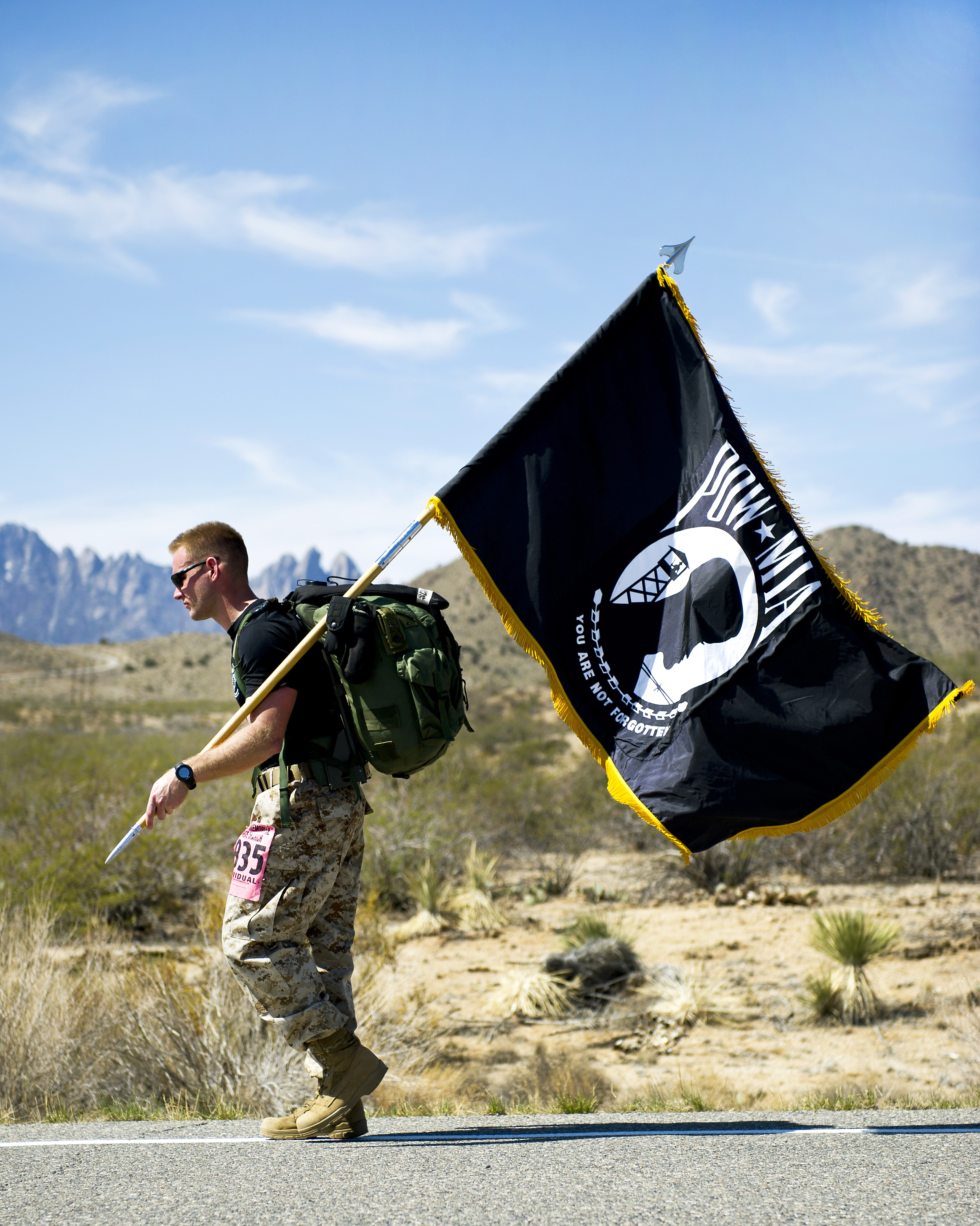 A participant in the 23rd Annual Bataan Memorial Death March carries a