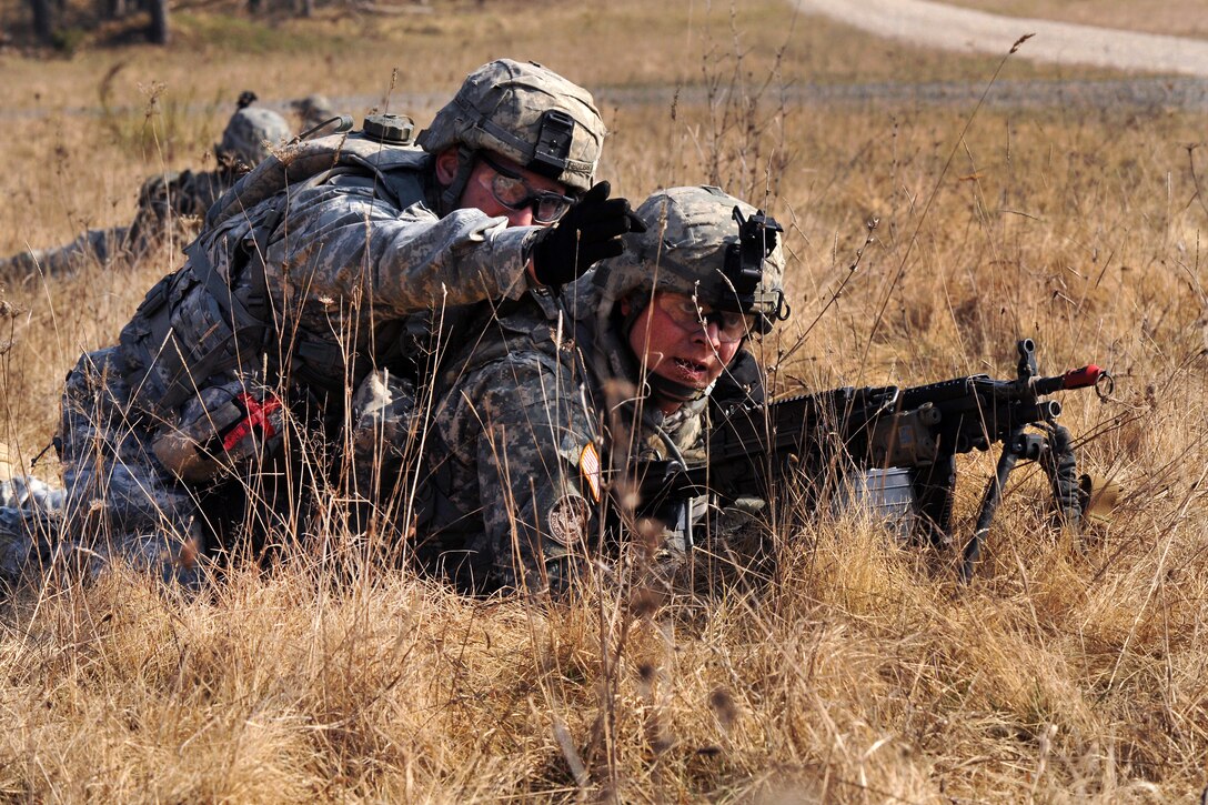 U.S. Army Spc. James Bolish, left, gives sector of fire directions to U.S. Army Spc. Theodore Renner during a situational training exercise at Grafenwoehr Training Area, Joint Multinational Training Command in Vilseck, Germany, March 22, 2012. Bolish and Renner, a squad automatic weapon gunner, are assigned to Company I, 3rd Squadron, 2nd Cavalry Regiment.