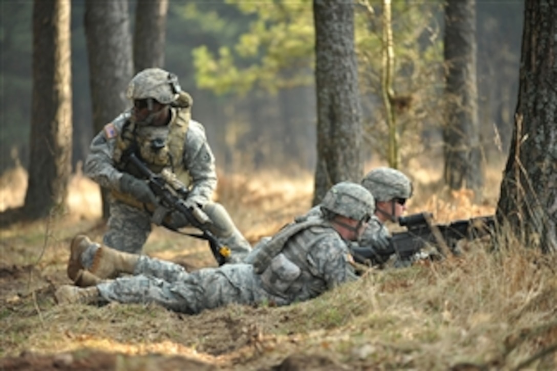U.S. Army soldiers with India Company, 3rd Squadron, 2nd Cavalry Regiment move through the terrain during a situational training exercise at the Grafenwoehr Training Area in Grafenwoehr, Germany, on March 22, 2012.  