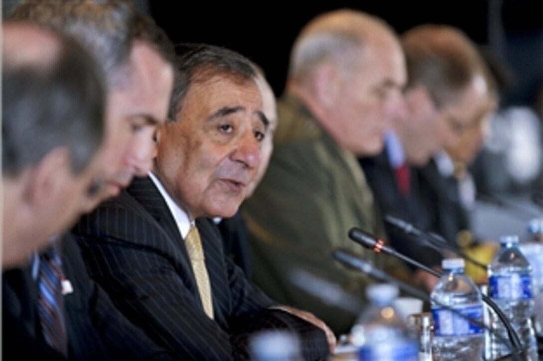 U.S. Defense Secretary Leon E. Panetta, center, engages in bilateral meetings with Mexican Defense Secretary Gen. Guillermo Galvan Galvan in Ottawa, Ontario, March 27, 2012. Panetta and Galvan later joined trilateral meetings with Canadian Defense Minister Peter MacKay.