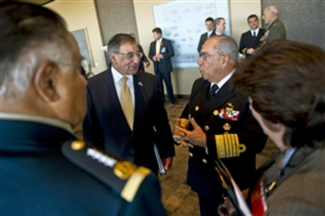 U.S. Defense Secretary Leon E. Panetta talks with Mexican Defense Secretary Gen. Guillermo Galvan Galvan before initiating trilateral meetings with defense ministers from Canada and Mexico in Ottawa, Ontario, March 27, 2012.
