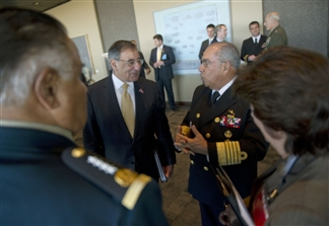 Secretary of Defense Leon E. Panetta converses with Mexican Secretary of National Defense Gen. Guillermo Galvan shortly before beginning trilateral meetings with Defense ministers from Canada and Mexico in Ottawa, Canada, on March 27, 2012. )