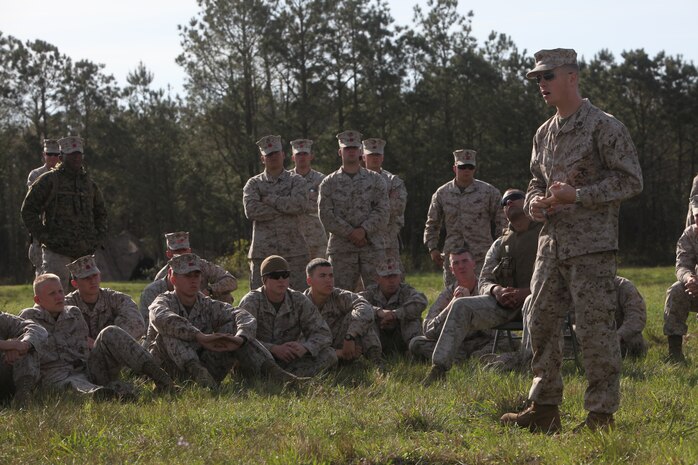 Sgt. Steven D. Potts (right), a chemical, biological, radiological and nuclear warfare specialist with Combat Logistics Regiment 27, 2nd Marine Logistics Group, teaches Marines of Landing Support Company, CLR-27, 2nd MLG about the different types of CBRN threats during a training session aboard Camp Lejeune, N.C., March 28, 2012. Potts, the lead instructor for the course, and his Marines also informed the LS Co. Marines how to react if an attack happened and how to properly wear Mission-Oriented Protective Posture gear.