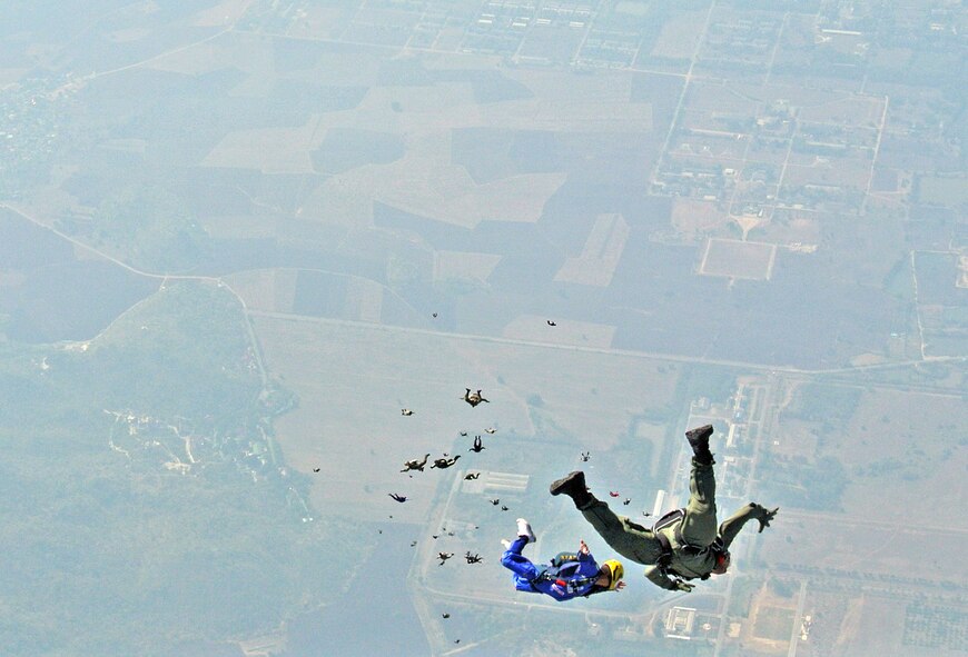 Royal Thai Air Force and Army military free fall personnel conduct a high altitude-low opening jump during Cope Tiger at Kohk Kathiam Drop Zone, Thailand, Mar. 22. More than 200 U.S. and Thai airmen and soldiers participated in the exercise’s largest bilateral freedom jump to close out the two-week long multi-lateral engagement between the U.S. Air Force, Royal Thai Air Force and Republic of Singapore Air Force. The exercise included a total of 92 aircraft and 34 air defense units, including U.S. platforms such as the C-130 Hercules, A-10 Thunderbolt II, C-17 Globemaster III, and F-15 Eagle. (Courtesy Photo/released)