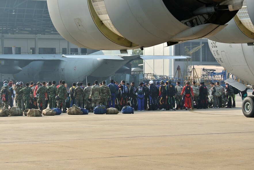 Royal Thai Air Force and Army military free fall personnel receive a mission brief from Royal Thai Air Force and U.S. Air Force jumpmasters at Don Mueang International Airport, Thailand prior to boarding a C-17 Globemaster III, Mar. 22. The airmen and soldiers participated in the exercise’s largest bilateral freedom jump to close out Cope Tiger, a two-week long multi-lateral, large force air employment exercise between the U.S. Air Force, Royal Thai Air Force and Republic of Singapore Air Force.  The exercise included a total of 92 aircraft and 34 air defense units, including U.S. platforms such as the C-130 Hercules, A-10 Thunderbolt II, C-17 Globemaster III, and F-15 Eagle. (U.S. Air Force Photo/Capt David Herndon/released)