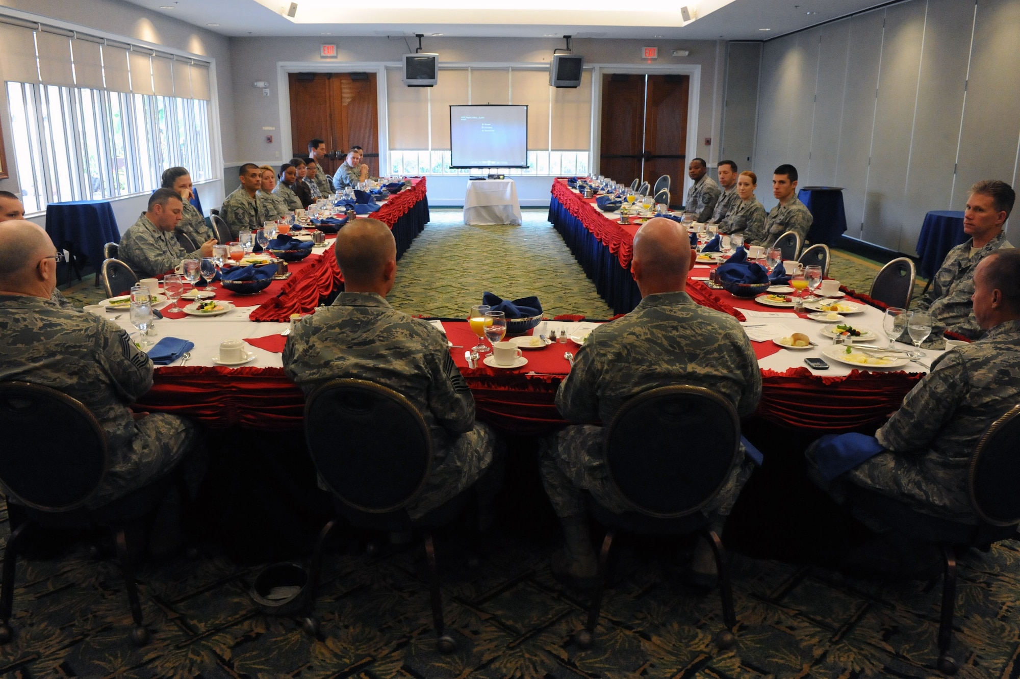 Attendees of the 2012 Air Force Assistance Fund kickoff breakfast discuss the history of the AFAF March 22 at the Tradewinds enlisted club on Joint Base Pearl Harbor Hickam, Hawaii. Two of the programs supported by the Air Force Aid Society include the interest-free "Falcon" loan program and the Spouse Tuition Assistance Program. (U.S. Air Force photo by Staff Sgt. Nathan Allen)
