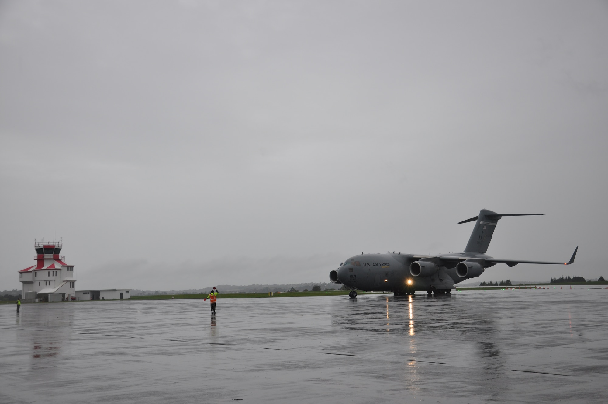 A U.S. Air Force C-17 Globemaster III assigned to the 517th Airlift Squadron at Joint Base Elmendorf-Richardson, Alaska arrived at Royal New Zealand Air Base Whenuapai, Saturday March 24, 2012. Over the next two weeks aircrews will work alongside regional partners to conduct low-level navigation and airdrop missions, increasing interoperability and enhancing military to military relationships. (U.S. Air Force photo by Capt. Rebecca Heyse/Released)