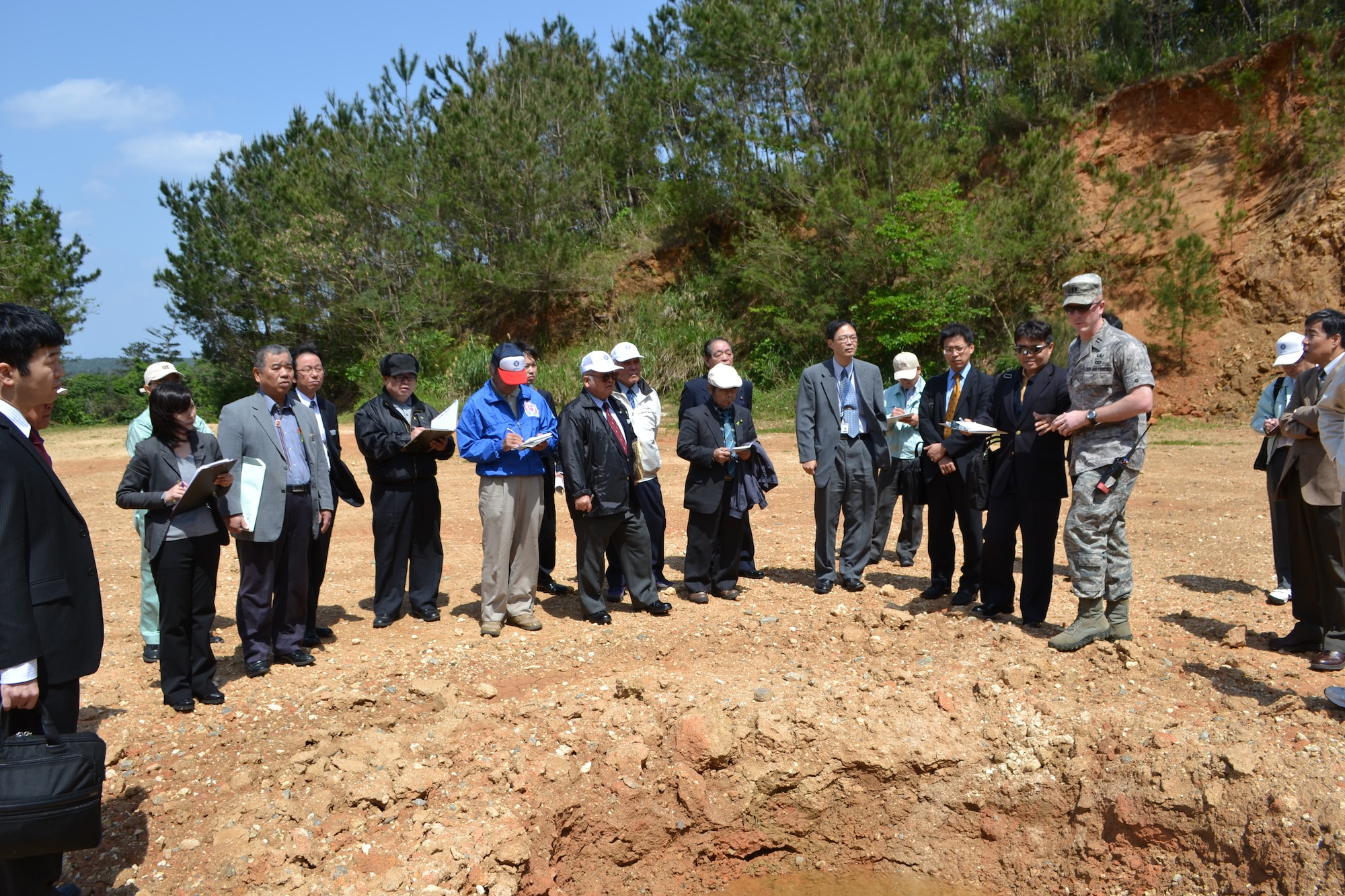U.S. Air Force Captain Kelly Mattie, Explosives Ordnance Disposal flight
commander, gives local community members a tour of the EOD site after briefing them about the EOD mission, why EOD operations are conducted at Kadena Air Base, and how the operations are conducted to ensure the safety of the community March 25, 2012, at Kadena Air Base, Japan. Community members who attended were from the Yomitan Village assembly, Kadena Town base affairs committee, Okinawa Defense Bureau, and the Minter of Foreign Affairs Okinawa office. Kadena Town Mayor Hiroshi Toyama also attended the briefing. 