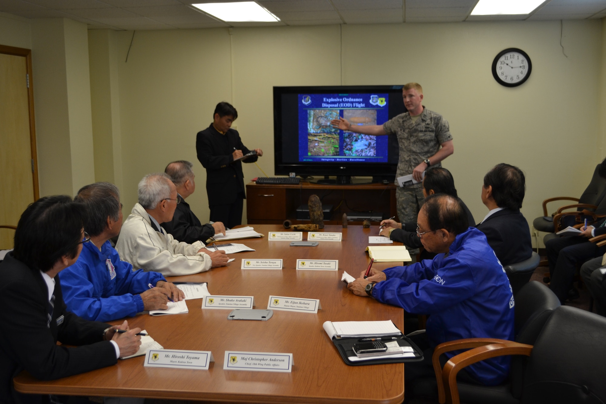 U.S. Air Force Captain Kelly Mattie, Explosives Ordnance Disposal flight
commander, briefs local community members about the EOD mission, why EOD
operations are conducted at Kadena Air Base, and how the operations are
conducted to ensure the safety of the community March 25, 2012, at Kadena Air Base, Japan. Community members who attended were from the Yomitan Village assembly, Kadena Town base affairs committee, Okinawa Defense Bureau, and the Minter of Foreign Affairs Okinawa office. Kadena Town Mayor Hiroshi Toyama also attended the briefing. After the briefing, the group was given a tour of the EOD site.

