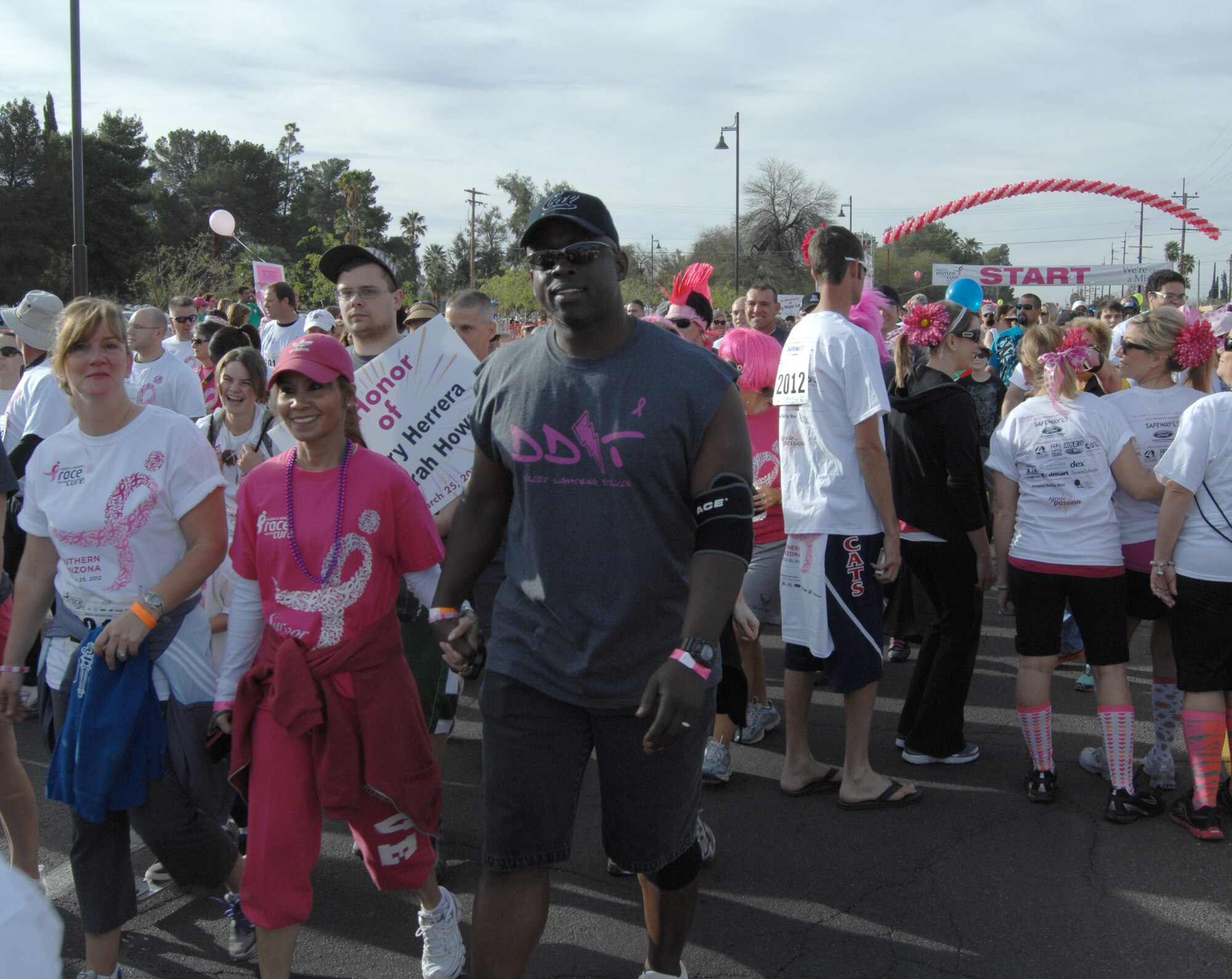 Chief Master Sgt. Vincent Howard, 355th Fighter Wing command chief, walks with his wife Sarah at the Susan G. Komen Race for the Cure 5K at Reid Park March 25. The Airmen came out to support Sergeant Herrera and also Sarah, who was recently diagnosed with breast cancer. (U.S. Air Force photo by Airman 1st Class Michael Washburn/Released)