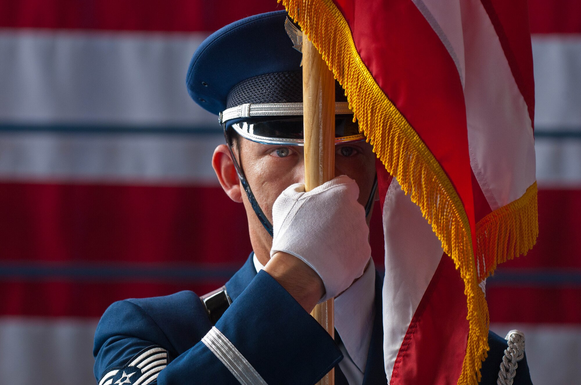 Tech. Sgt. Michael Lewis, NCO in charge of the Ellsworth Honor Guard, serves with a color guard during a change of command and retirement ceremony at Ellsworth Air Force Base, S.D., March 23, 2012. The base honor guard is responsible for providing military honors throughout a 114,636 square mile area covering South Dakota, western Nebraska and northern Wyoming. (U.S. Air Force photo by Airman 1st Class Zachary Hada/Released) 
