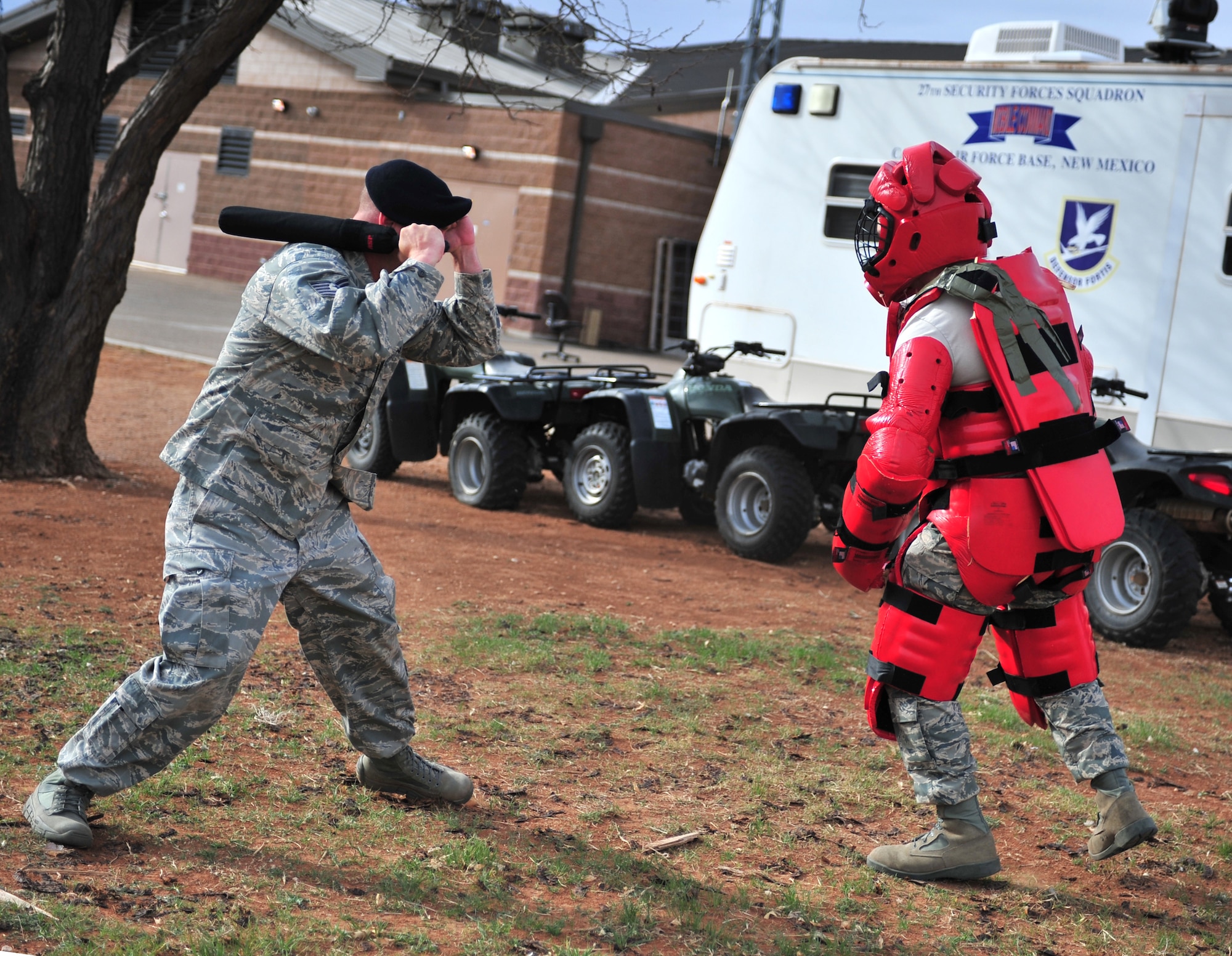 U.S. Air Force Tech. Sgt. William Lannon, 27th Special Operations Security Forces Squadron patrolman, demonstrates baton training on another 27 SOSFS member at Cannon Air Force Base, N.M., March 21, 2012. Security forces members conduct training throughout the year to maintain certifications, qualifications and mission readiness. (U.S. Air Force photo by Airman 1st Class Alexxis Pons Abascal) 