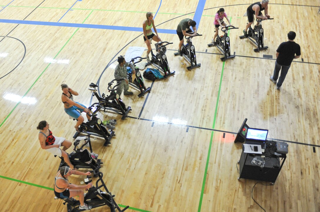 Participants ride the stationary bikes during the Bellamy Fitness Center’s Indoor Triathlon at Ellsworth Air Force Base, S.D., March 24, 2012.   The stationary bikes were all set up so that each competitor’s time and distance would be recorded.  (U.S. Air Force photo by Airman 1st Class Anania Tekurio/Released)