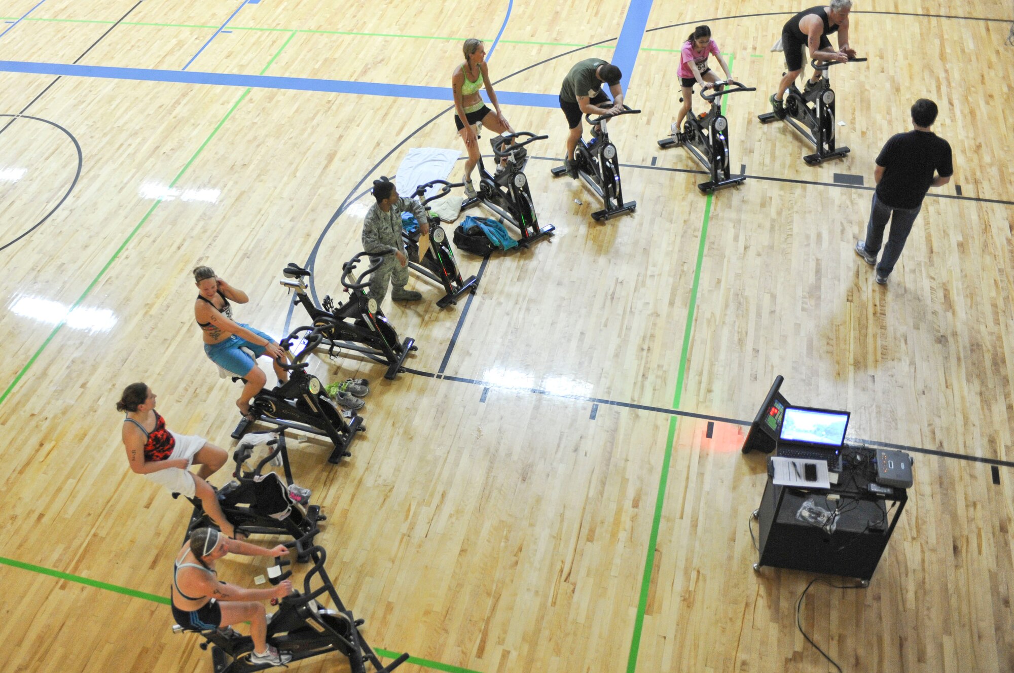 Participants ride the stationary bikes during the Bellamy Fitness Center’s Indoor Triathlon at Ellsworth Air Force Base, S.D., March 24, 2012.   The stationary bikes were all set up so that each competitor’s time and distance would be recorded.  (U.S. Air Force photo by Airman 1st Class Anania Tekurio/Released)