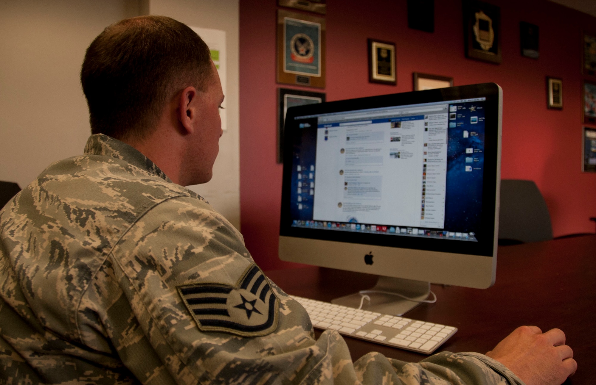 Staff Sgt. David Carbajal, Joint Base McGuire-Dix-Lakehurst media relations specialist, updates the JB MDL Facebook page. The JB MDL Facebook page reached 5,000 likes March 27. (U.S. Air Force photo by Airman 1st Class Dennis Sloan/Released)