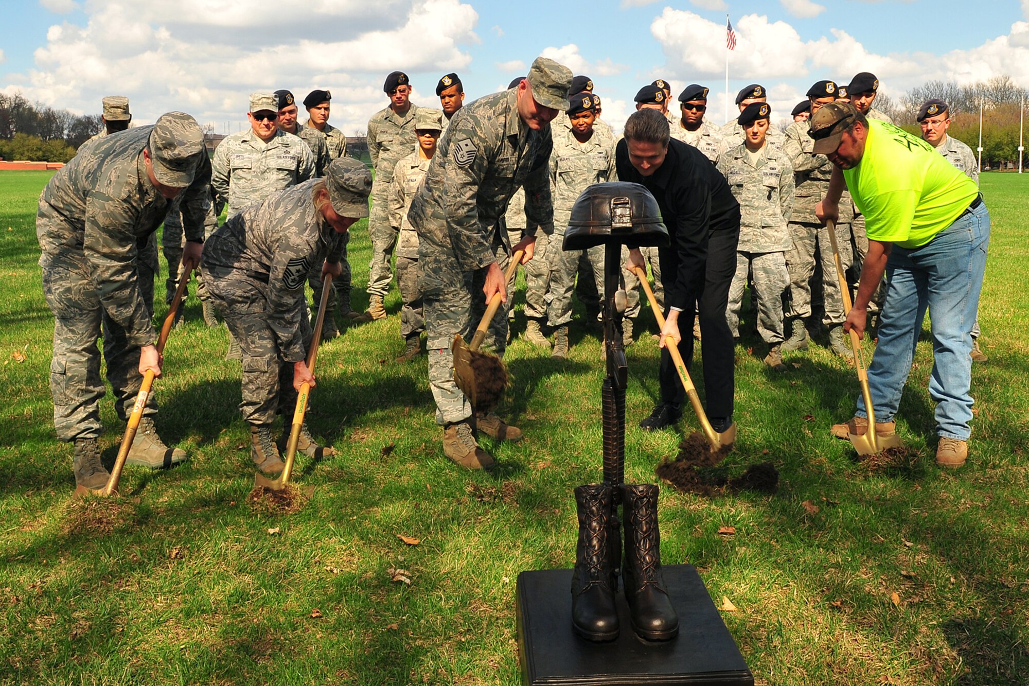 From left to right: Col. Kevin Dixon, 55th Wing vice commander, Chief Master Sgt. Suzan Sangster, 55th WG command chief, Master Sgt. Charles Puffer, 55th Security Forces first sergeant, Morgan McGary, a contractor on base and recently retired Air Force master sergeant, and Lou McCollor, L.J. Construction, perform the ceremonial ground breaking on the Offutt Fallen Warrior Memorial March 23. The memorial will be approximately 90’ square feet in size and features a polished black star with the seals of each service represented in bronze around it. In the center of the star will be the customary boots, rifle and helmet in bronze, constantly lit by solar accent lights. (Photo by Charles Haymond/Released)