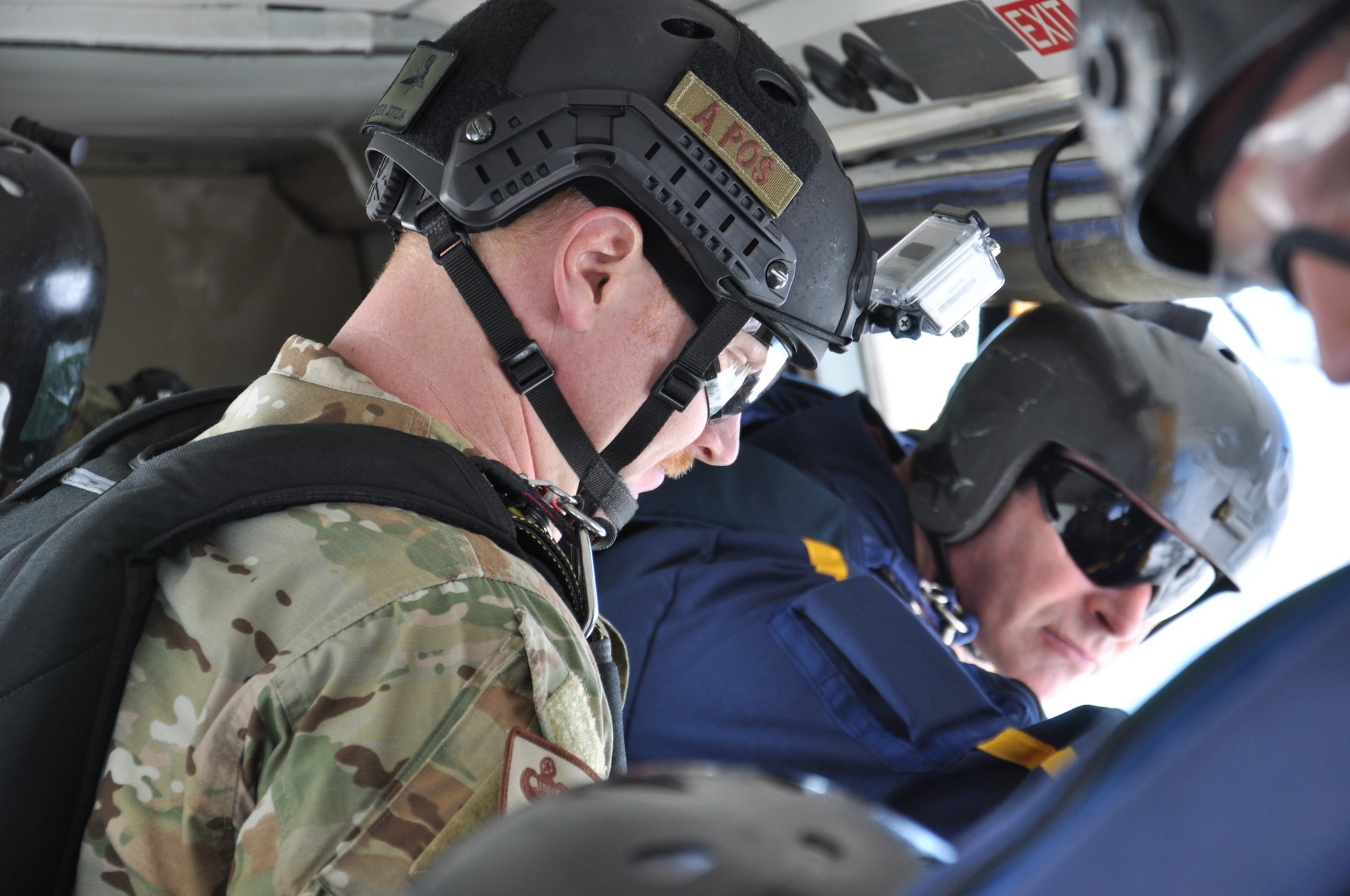 USAF and RNZAF Airmen prepare for a combined parachute jump over Royal New Zealand Air Force Base Whenuapai, Monday March 26, 2012 during Exercise KIWI FLAG. In addition to conducting tactical airlift operations, subject matter expert exchanges in aeromedical evacuation, aircraft maintenance and parachute jumps during which personnel exchange best practices and tactics. (U.S. Air Force photo by Capt. Rebecca Heyse/Released)