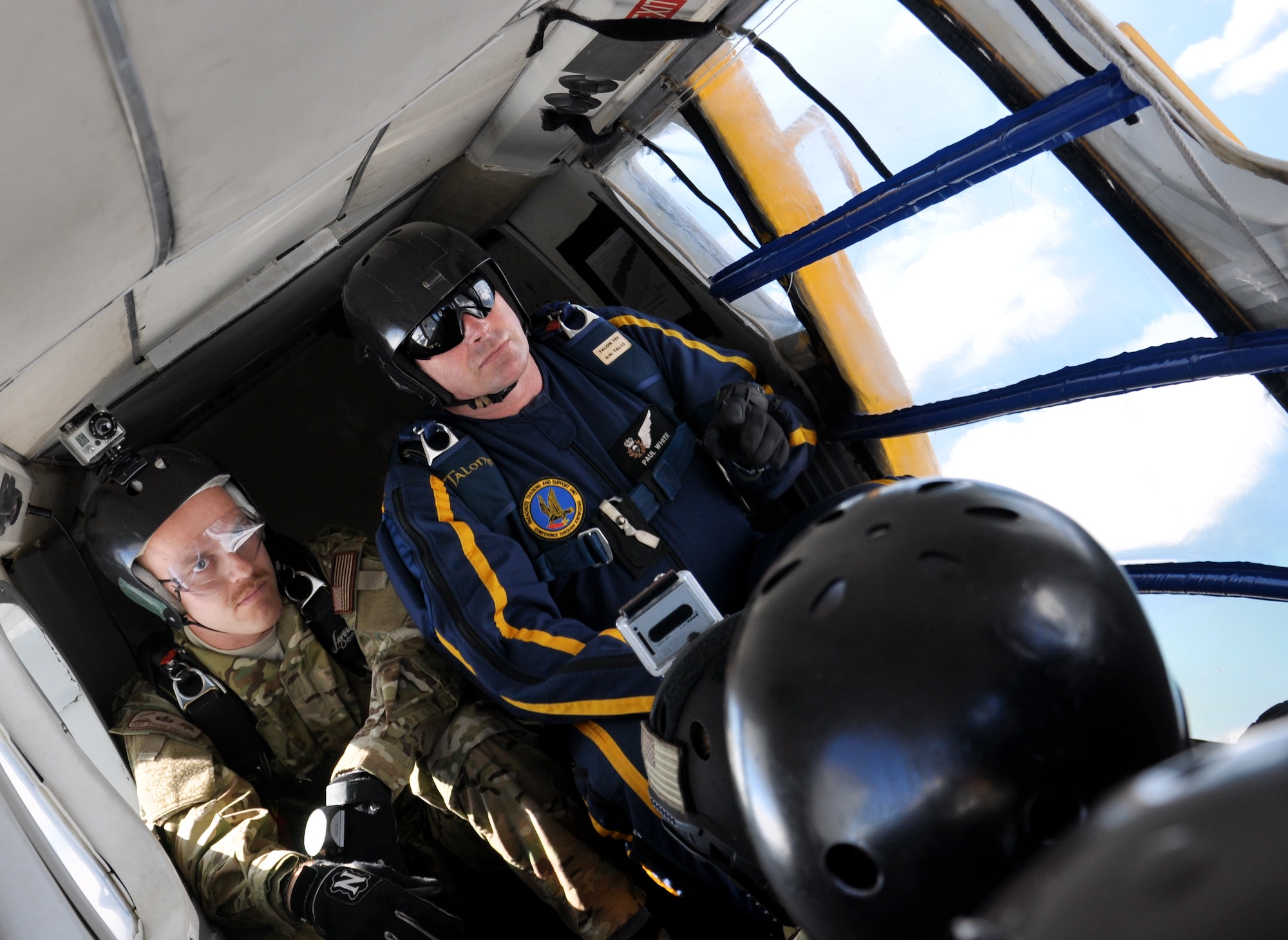 USAF and RNZAF Airmen prepare for a combined parachute jump over Royal New Zealand Air Force Base Whenuapai, Monday March 26, 2012 during Exercise KIWI FLAG. In addition to conducting tactical airlift operations, subject matter expert exchanges in aeromedical evacuation, aircraft maintenance and parachute jumps during which personnel exchange best practices and tactics. (U.S. Air Force photo by Capt. Rebecca Heyse/Released)