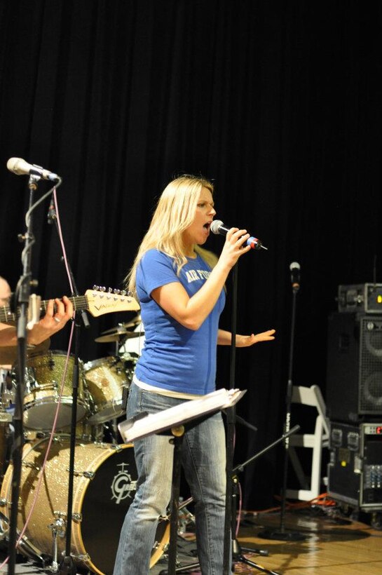 Vocalist SSgt Courtney Clifford performs with Top Flight at the Fiesta Military-Civilian Reception.