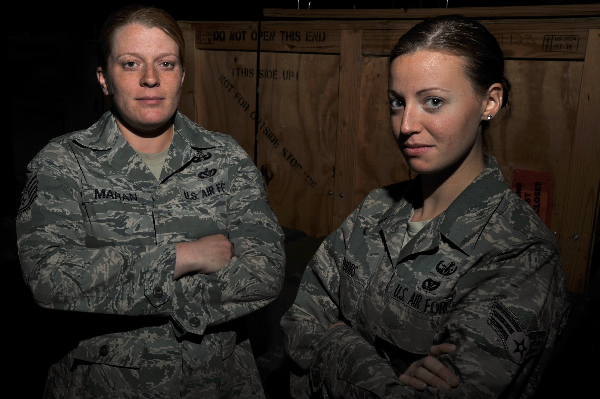 Tech. Sgt. Kim Mahan and Senior Airman Kristi Stubbs, both 20th Engineer Squadron explosive ordinance technicians, pose for a portrait in the bay of their shop, Feb. 15, 2012, Shaw Air Force Base, S.C. Both Mahan and Stubbs are two of the very woman that currently serve in the Air Force EOD career field. EOD techs are called upon when unexploded bombs need to be dealt with. (U.S. Air Force photo by Senior Airman Kenny Holston/Released)

