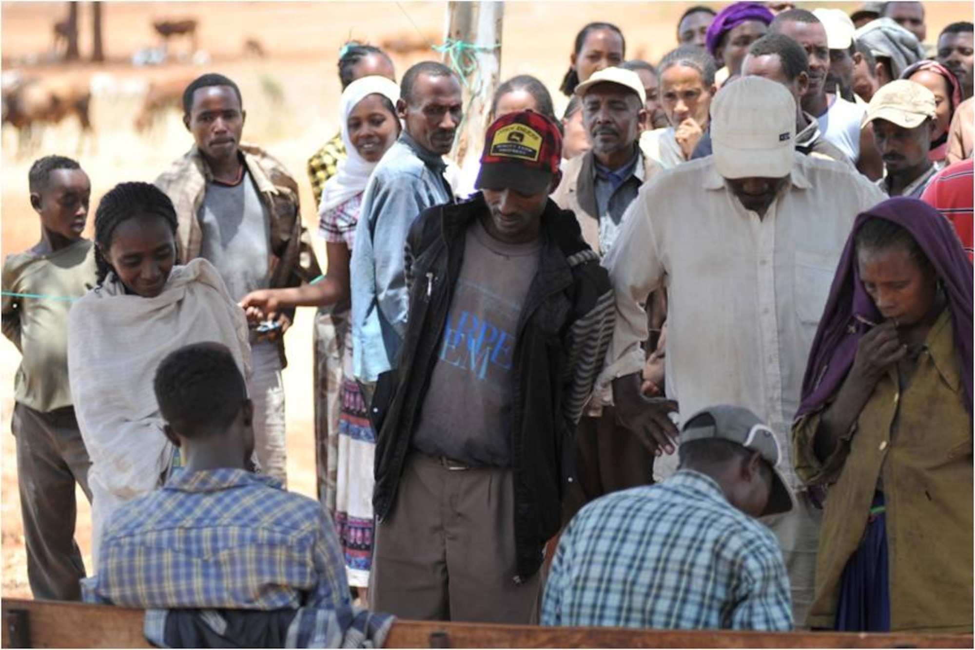 DEBAKA DEBOBESA, Ethiopia (Mar. 15, 2012) - A group of people wait as the Civil Affairs Team 4905 delivers bed nets in Debaka Debobesa, Ethiopia on 15 March. As part of an effort to quell an expected spike of malaria in the region, Civil Affairs Team 4905 delivered 18,000 packs of insecticide-treated bed nets, rope and nails to Ethiopians in Samaro and Debaka Debobesa. (U.S. Air Force photo by Technical Sergeant James Brock)