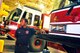 Marcus White, a Robins Fire Department lieutenant, looks over the flightline from the bay area of the fire station during the night shift. (U. S. Air Force photo by Sue Sapp)