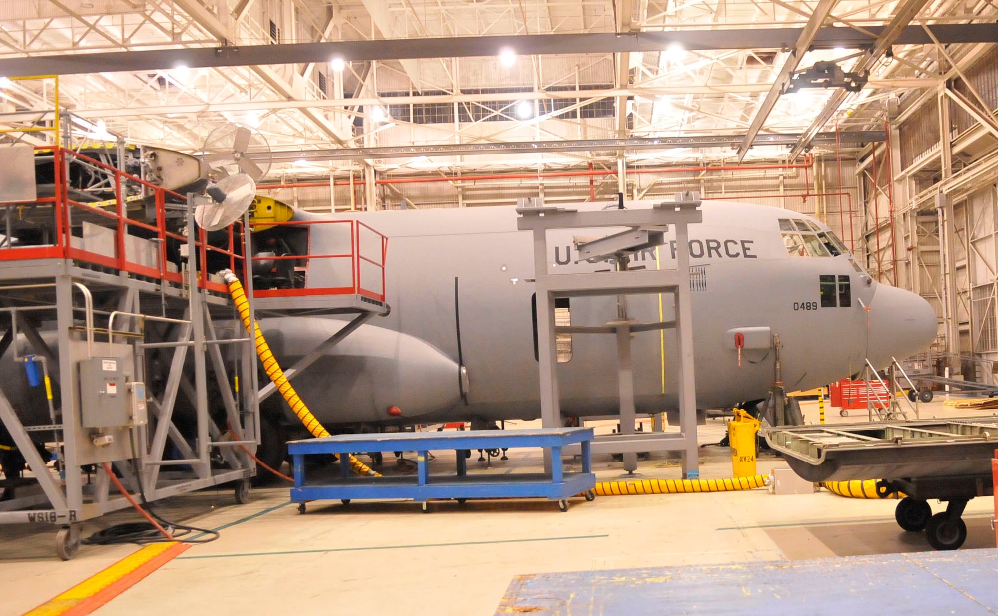A C-130 undergoing the replacement of the center wing box by the 560th Aircraft Maintenance Squadron sits in a hangar at Robins. U. S. Air Force photo by Sue Sapp (U. S. Air Force photo by Sue Sapp)