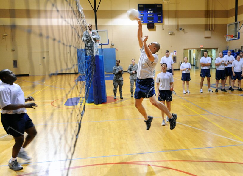 U.S. Air Force Senior Airman Isacc Lopez, 55th Fighter Squadron Shooters crew chief, jumps to hit the ball during a volleyball game against the Chiefs at the Fitness Center, Shaw Air Force Base, S.C., March 20, 2012. ALS is a five-week course designed to turn Airmen into supervisors that focuses on leadership and leadership duties. (U.S. Air Force photo by Senior Airman Tabatha McCarthy/released)
