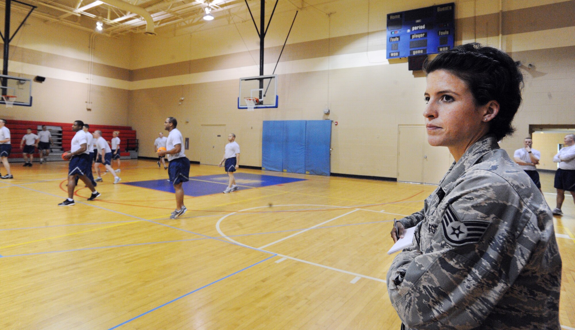 U.S. Air Force Staff Sgt. Shelby Bird, 20th Force Support Squadron Airmen Leadership School instructor, watches her Ravens flight play a game of dodge ball against the Shaw first sergeants at the Fitness Center, Shaw Air Force Base, S.C., March 20, 2012. ALS is a five-week course designed to turn Airmen into supervisors that focuses on leadership and leadership duties. (U.S. Air Force photo by Senior Airman Tabatha McCarthy/released)