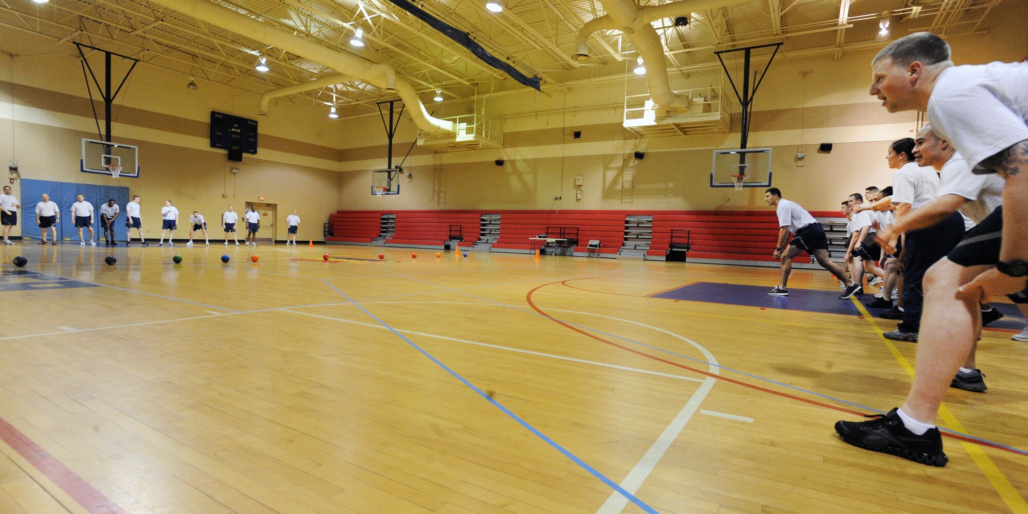 U.S. Air Force Airmen Leadership School, Class 12-3 Mustang flight prepares to play a game of dodge ball against the Shaw first sergeants at the Fitness Center, Shaw Air Force Base, S.C., March 20, 2012. ALS is a five-week course designed to turn Airmen into supervisors that focuses on leadership and leadership duties. (U.S. Air Force photo by Senior Airman Tabatha McCarthy/released)
