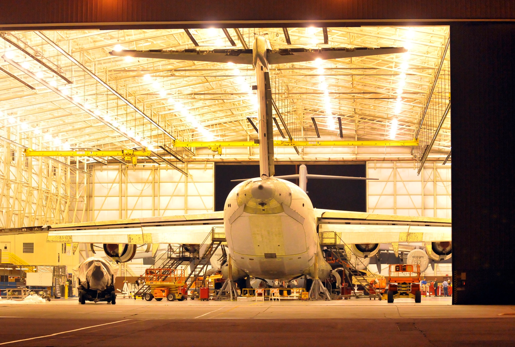 A C-17 undergoing maintenance by the owl shift crew sits in a hangar at Robins. (U. S. Air Force photo by Sue Sapp)