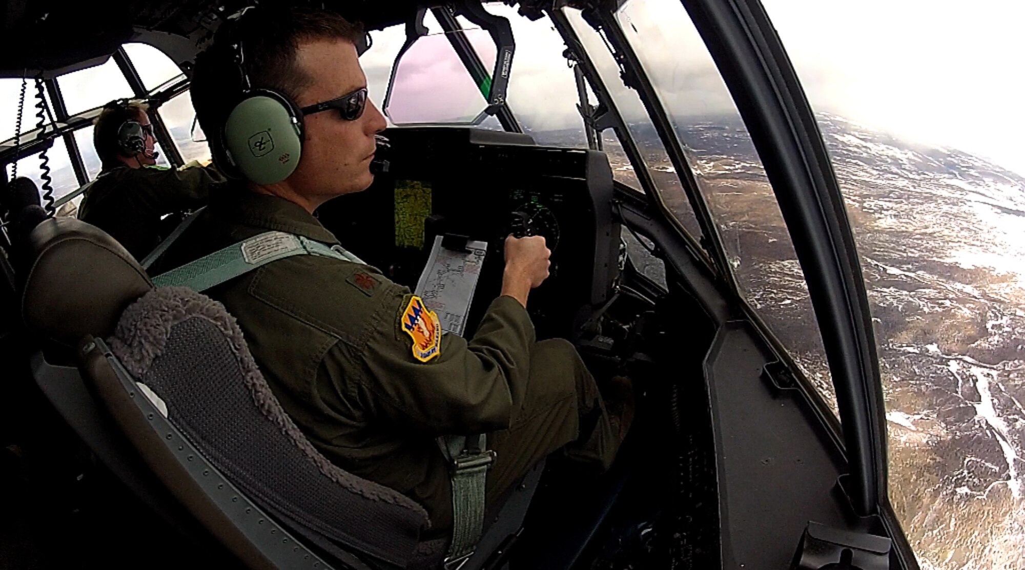 U.S. Air Force Maj. Justin Diehl, 317th Airlift Group, flies a C-130J March 19, 2012 during a training exercise over Colorado. In the past, the training in the United States for C-130s didn’t match the routings and airdrop profiles that were being flown in Afghanistan or Iraq. Now, here at Dyess, training has been brought into the 21st century mirroring actual deployment tactics the pilots will face down range. This training supports current conflicts, but also helps 317th aircrews prepare to bring relief to nations in distress, such as Japan in 2011 and Haiti in 2010. (U.S. Air Force photo by Airman 1st Class Damon Kasberg/Released)