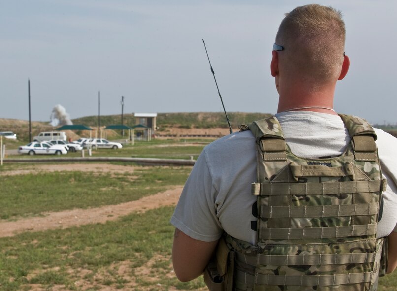 U.S. Air Force Staff Sgt. Micah Price, 7th Civil Engineer Squadron, detonates two C-4 sticks attached to M10A3 grenade fuses March 26, 2012, at the Midland Police Department firing range in Midland, Texas. Military ordnances are detonated by Dyess explosive ordnance disposal teams due to their training and expertise. (U.S. Air Force photo by Airman 1st Class Jonathan Stefanko/ Released)