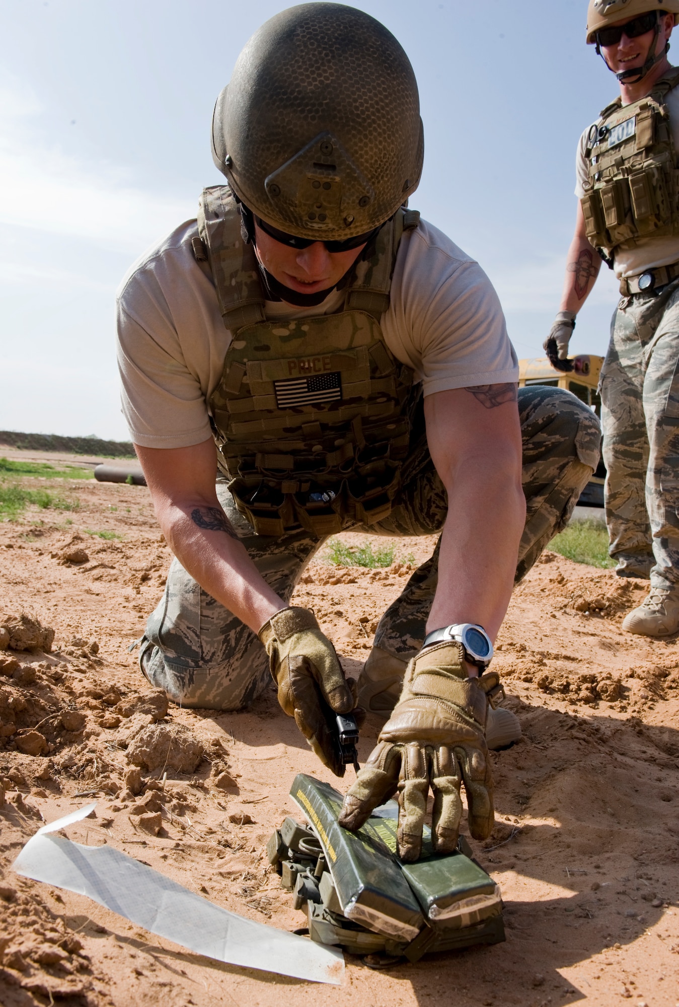 U.S. Air Force Staff Sgt. Micah Price, 7th Civil Engineer Squadron, prepares the detonation of M10A3 grenades March 26, 2012, at the Midland Police Department firing range in Midland, Texas. Military ordnances are detonated by Dyess explosive ordnance disposal teams due to their training and expertise. (U.S. Air Force photo by Airman 1st Class Jonathan Stefanko/ Released)